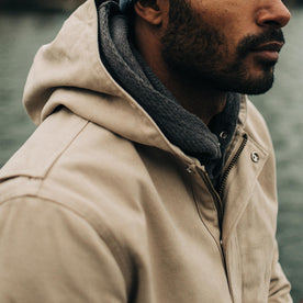 fit model wearing The Workhorse Hoodie in Sand Boss Duck with the hood down