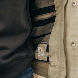 fit model showing the interior pattern detail of The Workhorse Hoodie in Sand Boss Duck