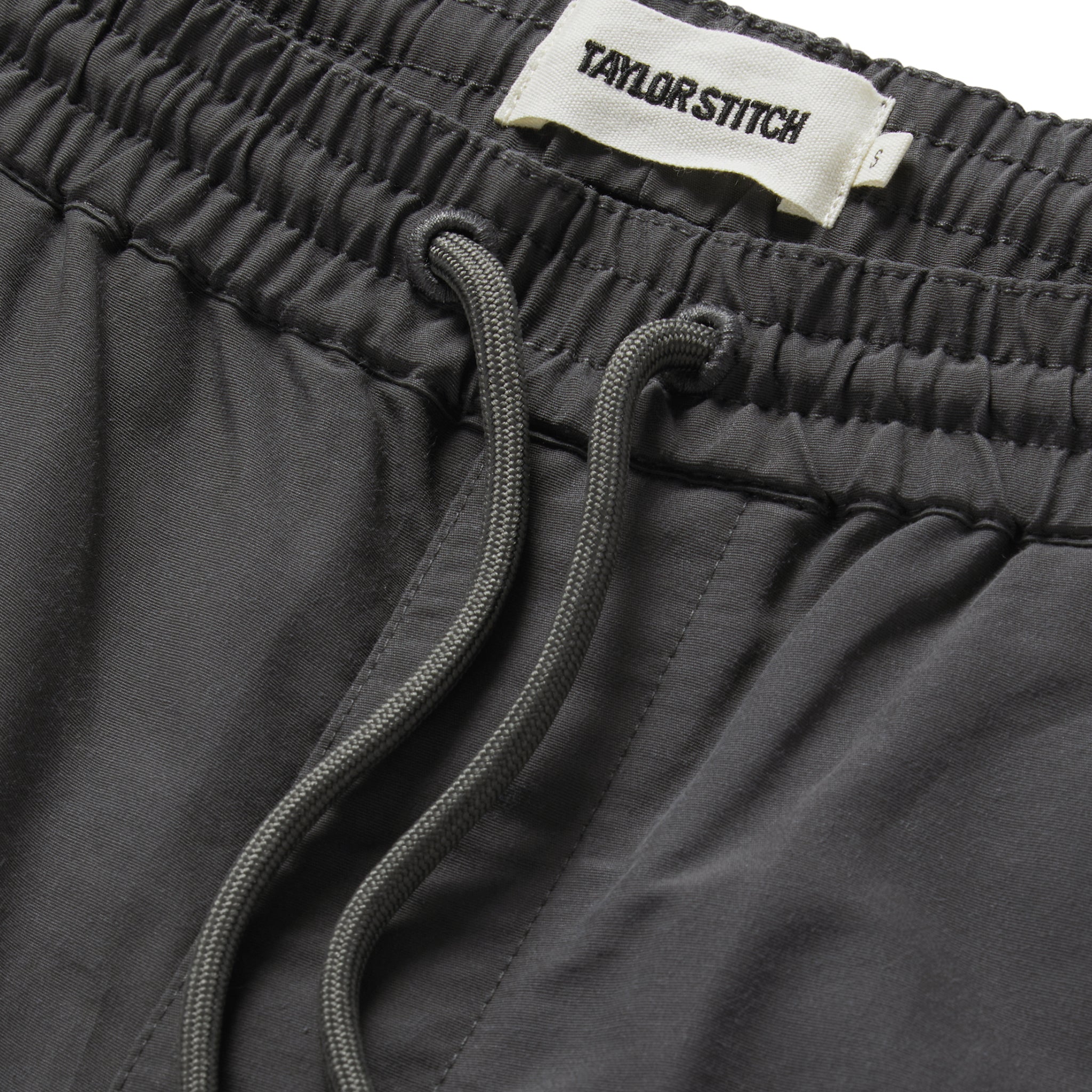 material shot of front drawcord on The Apres Short in Granite Sixty Forty, Bottoms by Taylor Stitch