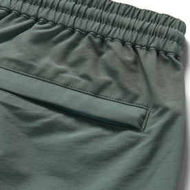 material shot of the back pocket of The Apres Short in Sea Green Sixty Forty