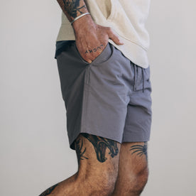fit model showing the side of The Apres Short in Smoke Sixty Forty