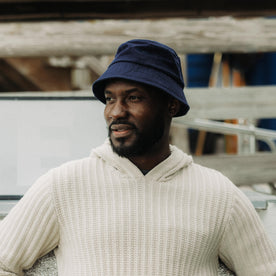 fit model posing in The Bucket Hat in Washed Navy Twill