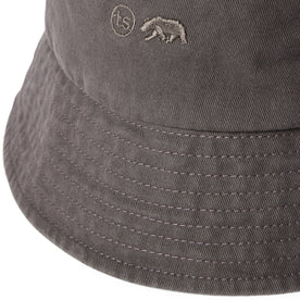 material shot of the logo on The Bucket Hat in Washed Taupe Twill