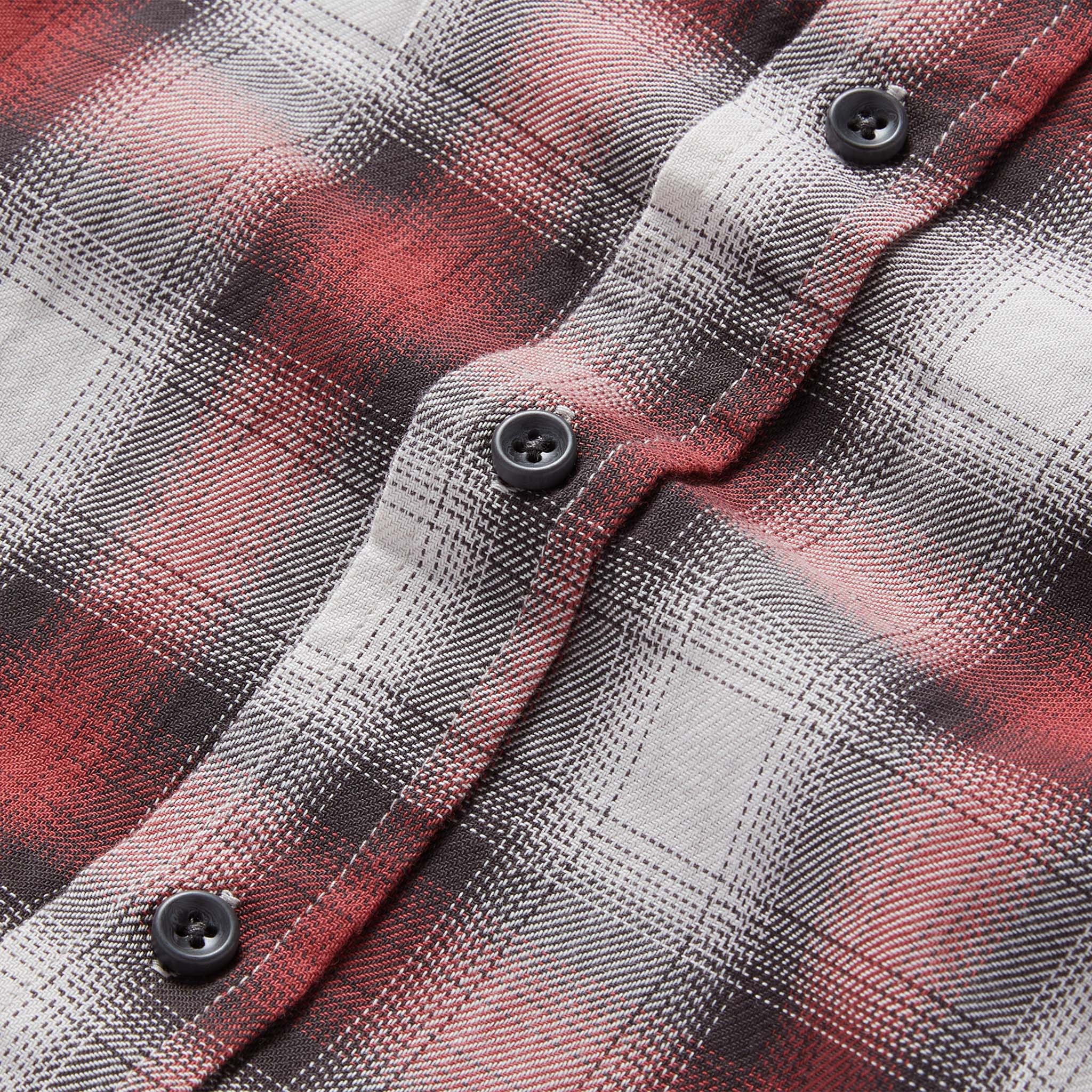 material shot of the buttons on The California in Brick Plaid Ombre Twill, Wovens by Taylor Stitch