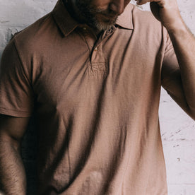 fit model showing the front of The Cotton Hemp Polo in Dried Acorn