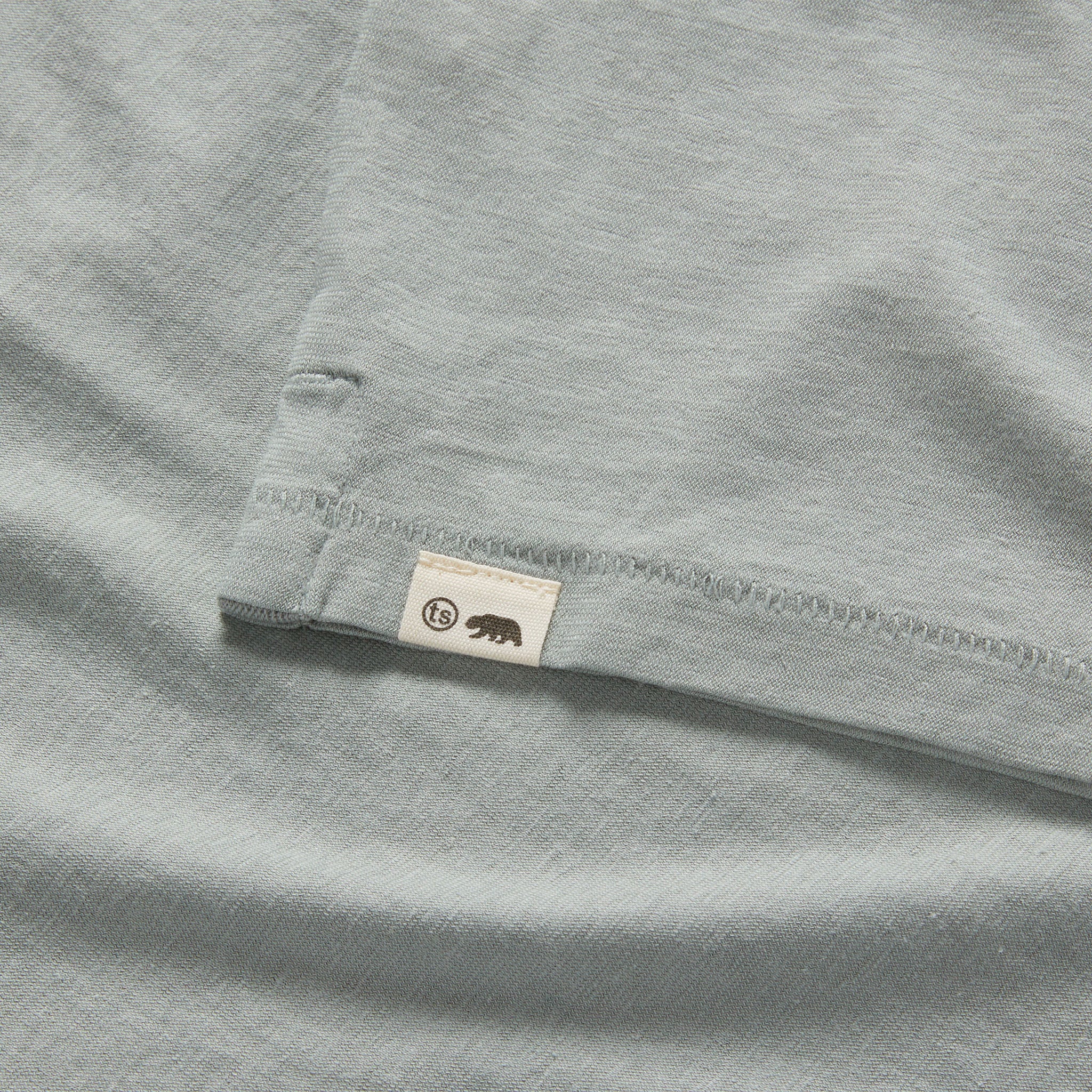 material shot of the hem on The Cotton Hemp Polo in Slate, Knits by Taylor Stitch