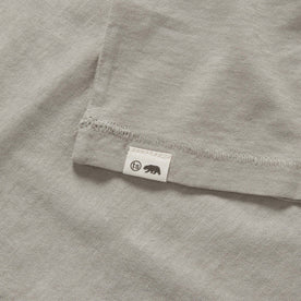 material shot of the TS label on The Cotton Hemp Tee in Sagebrush