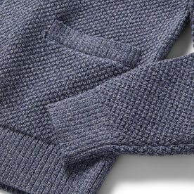 material shot of the sleeve and pocket on The Crawford Sweater in Blue Melange