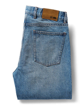 flatlay of the back of The Democratic Jean in Fletcher Wash Organic Selvage folded, Bottoms by Taylor Stitch