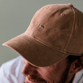 fit model showing pincer fabric on The Everyday Cap in Brick Pincord