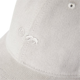 material shot of the logo on The Everyday Cap in Oyster Pincord