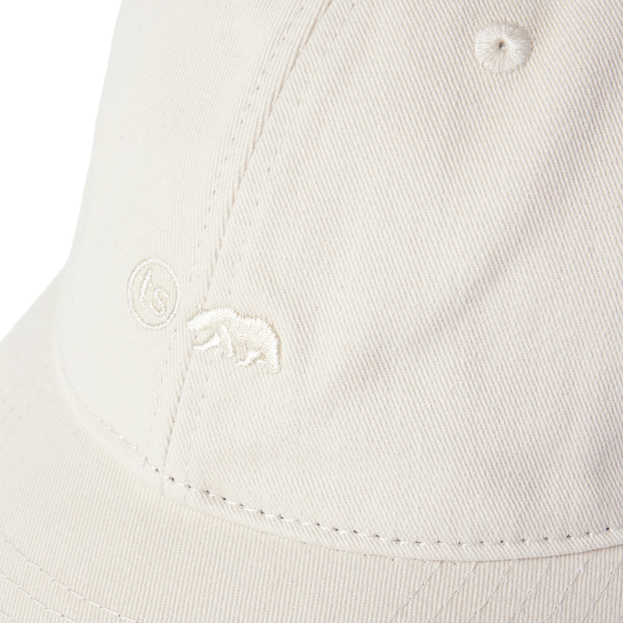 material shot of the logo on The Everyday Cap in Washed Stone Twill, Accessories by Taylor Stitch