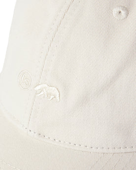 material shot of the logo on The Everyday Cap in Washed Stone Twill, Accessories by Taylor Stitch