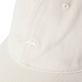material shot of the logo on The Everyday Cap in Washed Stone Twill