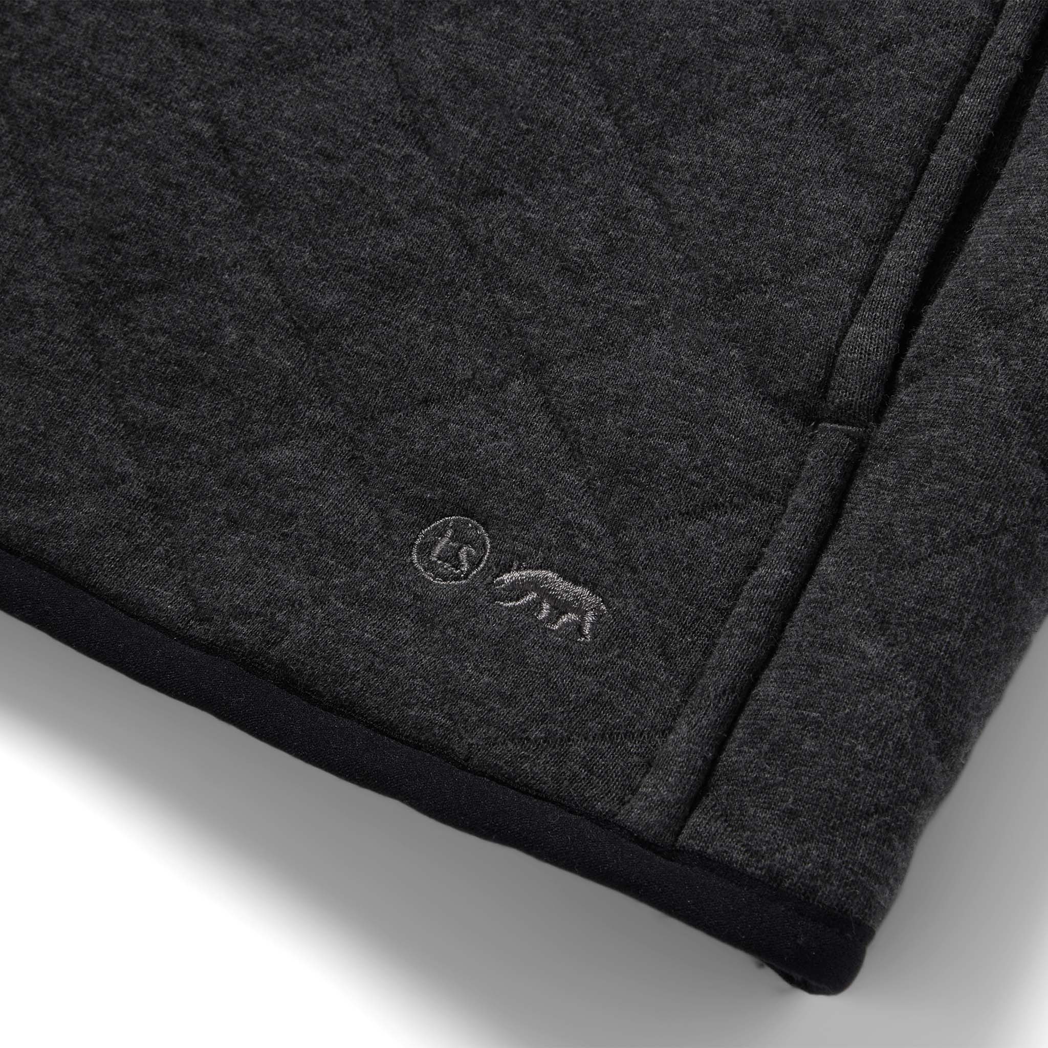 material shot of the TS logo on The Fall Line Pullover in Coal Heather, Knits by Taylor Stitch
