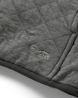 material shot of the TS logo on The Fall Line Pullover in Cypress Heather, Knits by Taylor Stitch