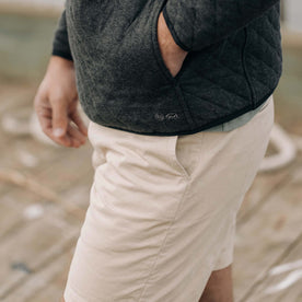 fit model showing the side of The Foundation Short in Organic Dune
