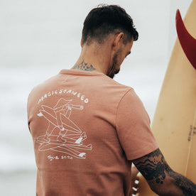 fit model showing the back of The Heavy Bag Tee in Dawn Patrol