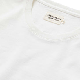 material shot of the label and neck opening on The Heavy Bag Tee in Sea Lettuce