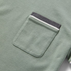 material shot of the chest pocket on The Heavy Bag Ringer Tee in Slate and Seed
