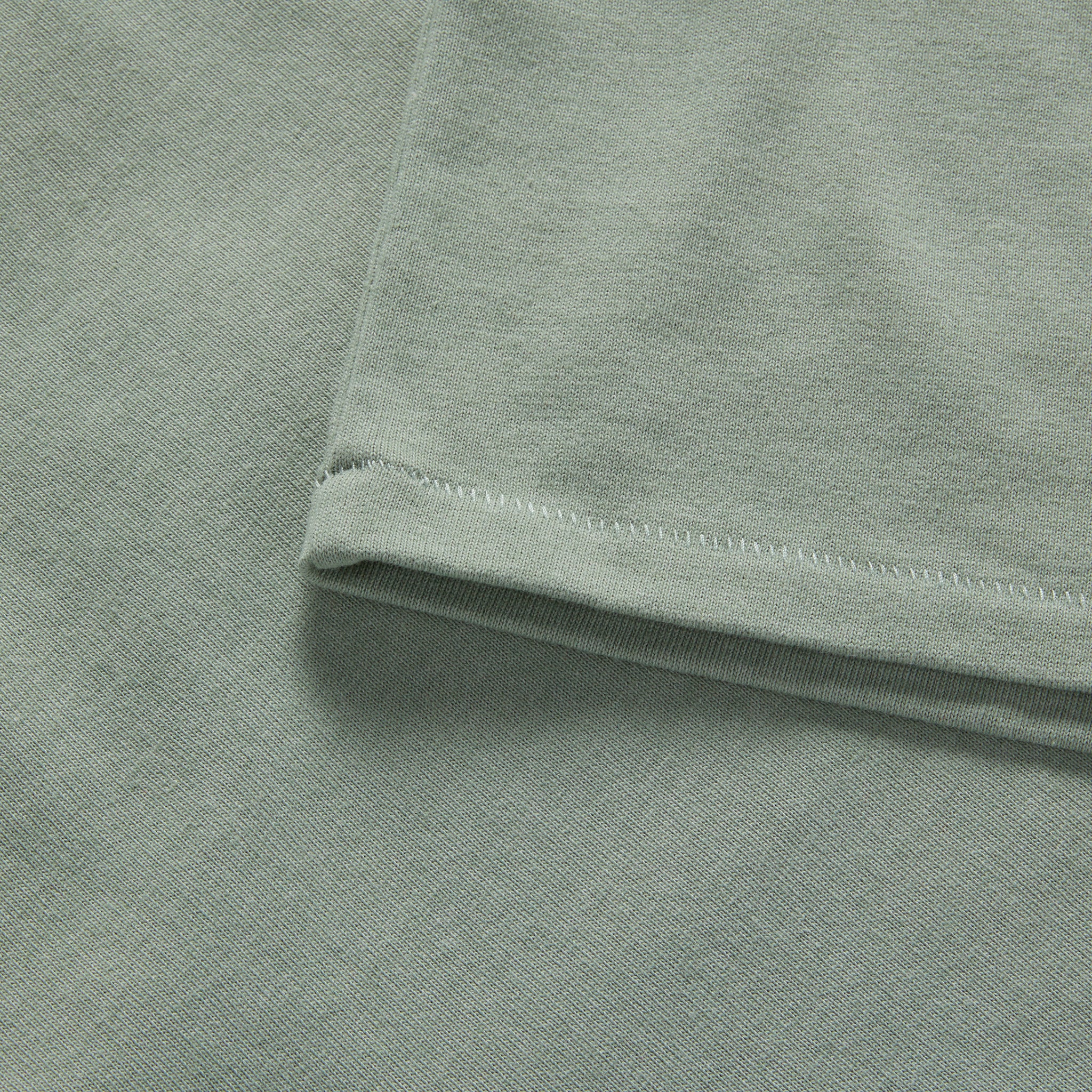 material shot of the sleeve on The Heavy Bag Ringer Tee in Slate and Seed, Knits by Taylor Stitch