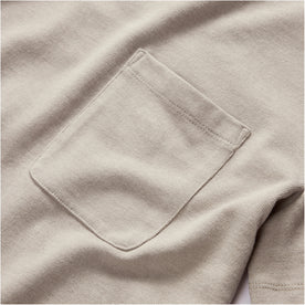material shot of the chest pocket on The Heavy Bag Tee in Arid Eucalyptus