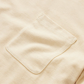 material shot of the chest pocket on The Heavy Bag Tee in Horchata