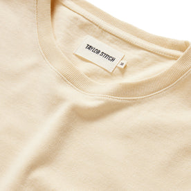 material shot of the neck opening of The Heavy Bag Tee in Horchata