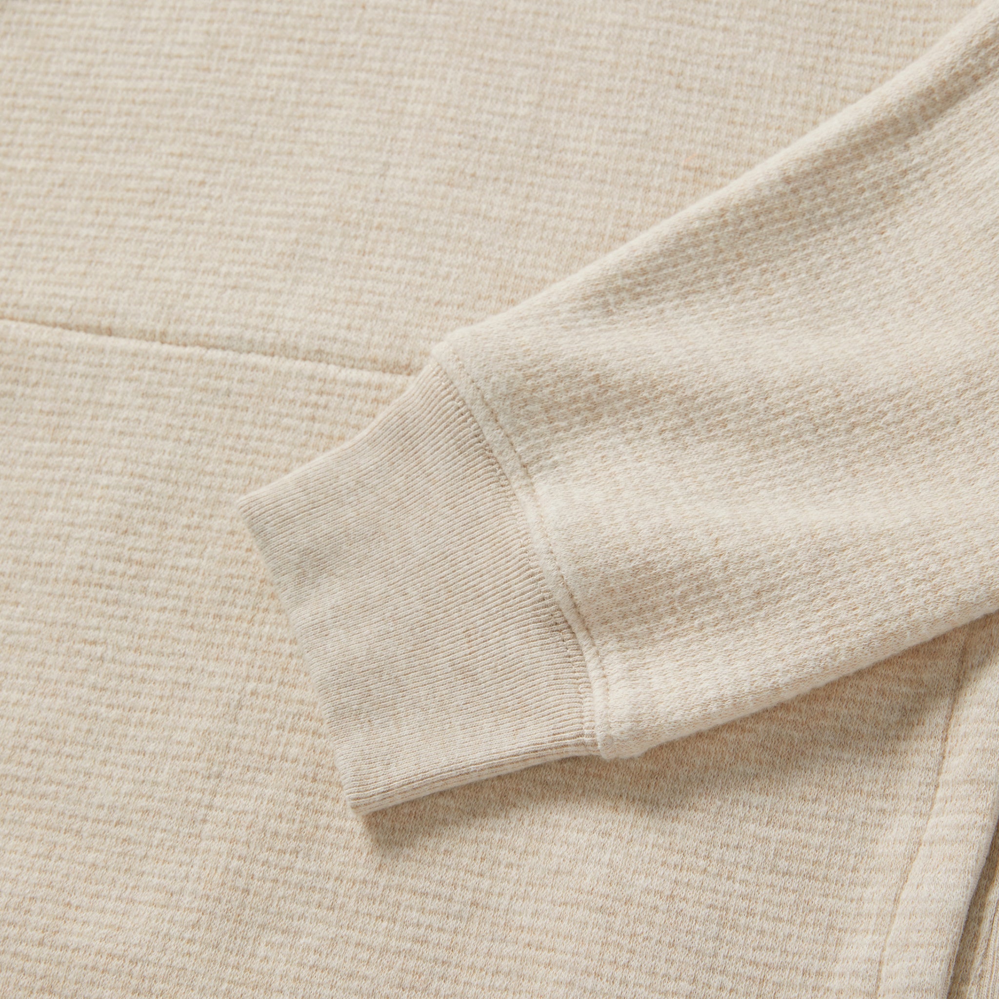 material shot of the sleeve on The Horizon Pullover in Oat Heather, Knits by Taylor Stitch