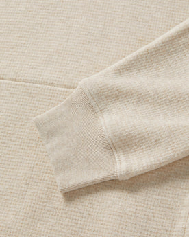 material shot of the sleeve on The Horizon Pullover in Oat Heather, Knits by Taylor Stitch