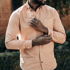 fit model adjusting the cuffs on The Jack in Dried Acorn Oxford