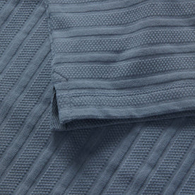 material shot of the hem on The Jacquard Polo in Storm