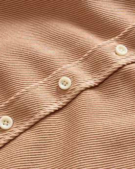 material shot of the buttons on The Ledge Shirt in Dusty Coral Twill, Wovens by Taylor Stitch