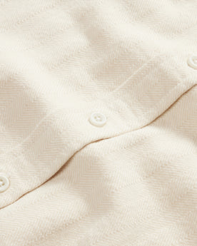 material shot of the buttons on The Ledge Shirt in Oyster Herringbone, Wovens by Taylor Stitch