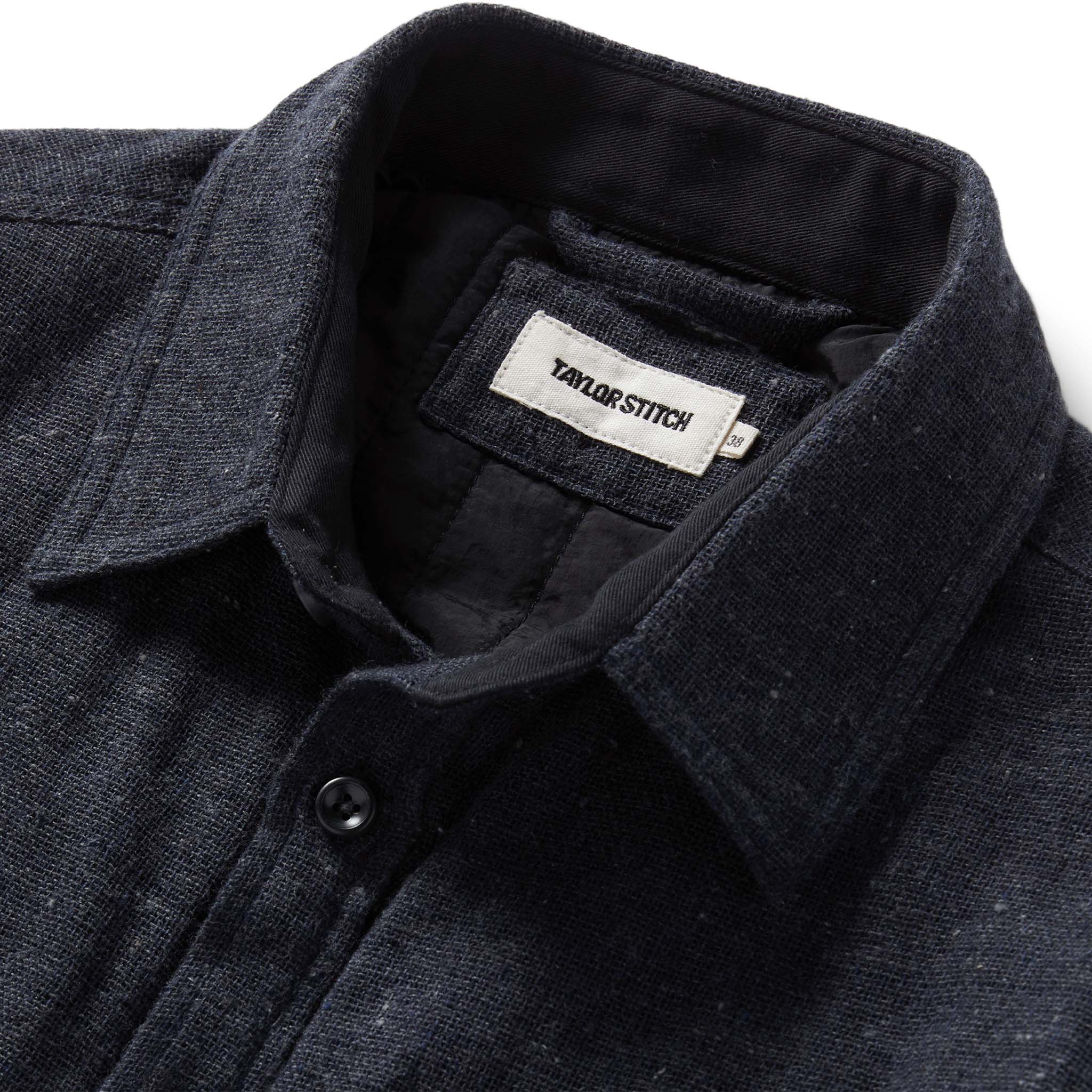 material shot of the collar on The Lined Utility Shirt in Charcoal Donegal, Outerwear by Taylor Stitch