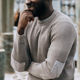 fit model posing in The Moor Sweater in Steeple Grey