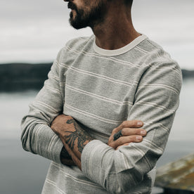 fit model with his arms crossed wearing The Morgan Crewneck in Ash Stripe