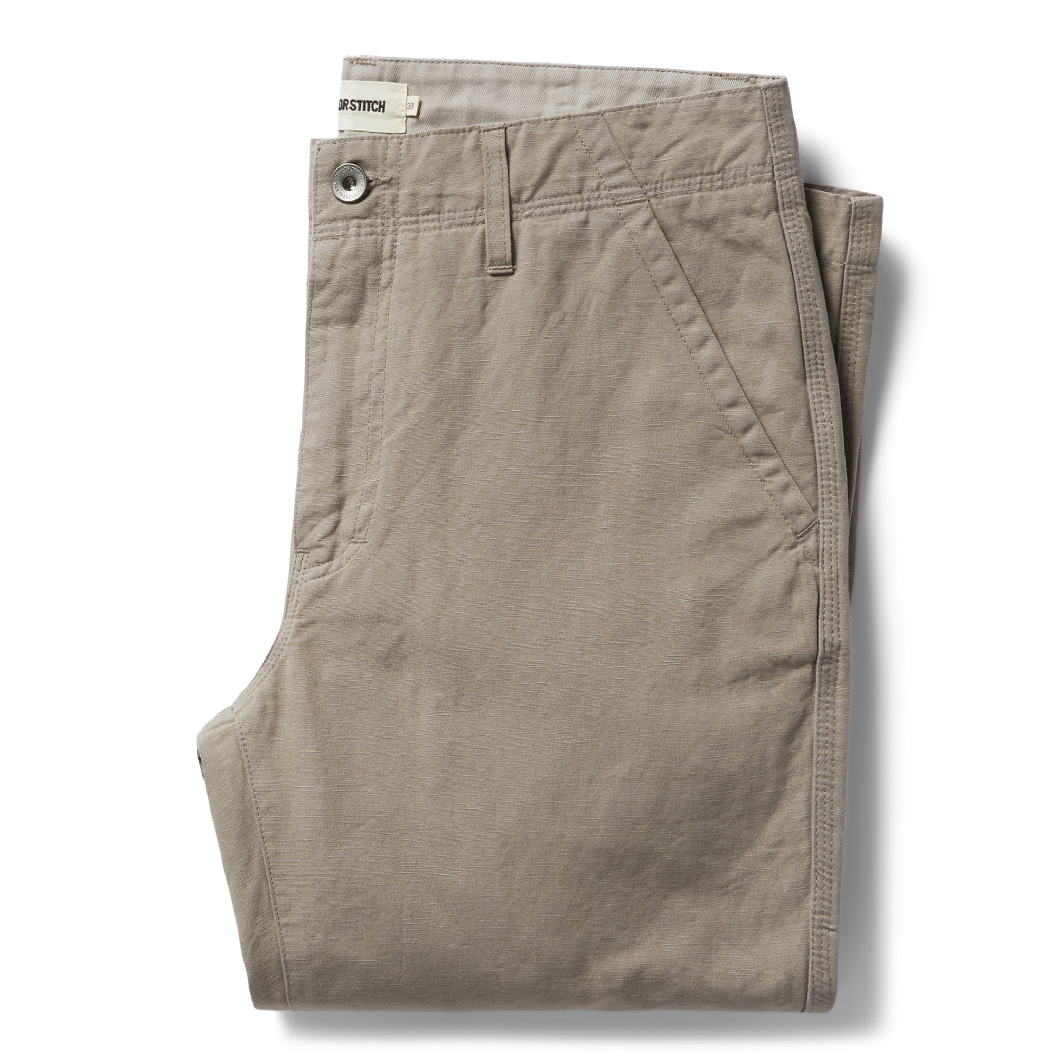 flatlay of The Morse Pant in Oyster Slub folded, Bottoms by Taylor Stitch