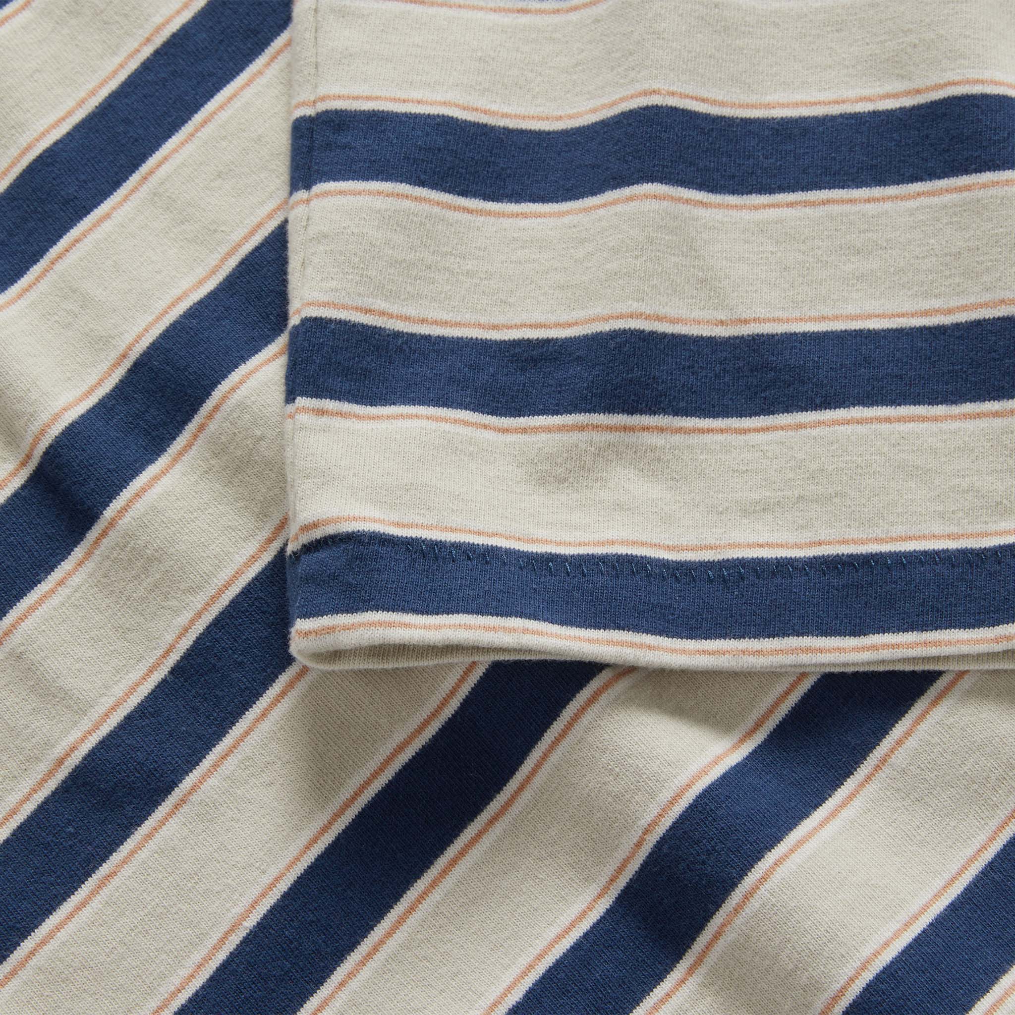 material shot of the sleeves on The Organic Cotton Tee in Daybreak Stripe, Knits by Taylor Stitch