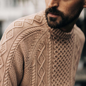 fit model showing the cable knit detail on The Orr Sweater in Dried Acorn
