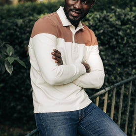 fit model posing in The Rugby Shirt in Mahogany and Natural Color Block