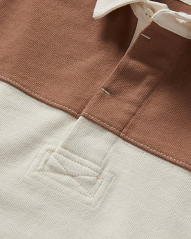 material shot of the buttons on The Rugby Shirt in Mahogany and Natural Color Block, Knits by Taylor Stitch