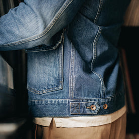 fit model showing the side of The Ryder Jacket in Sun Bleached Denim