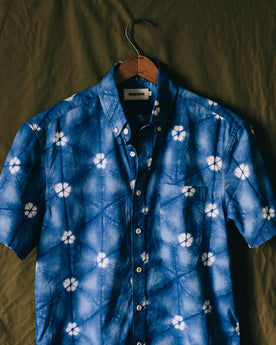 The Short Sleeve Jack in Deep Navy Floral on a green background, Wovens by Taylor Stitch