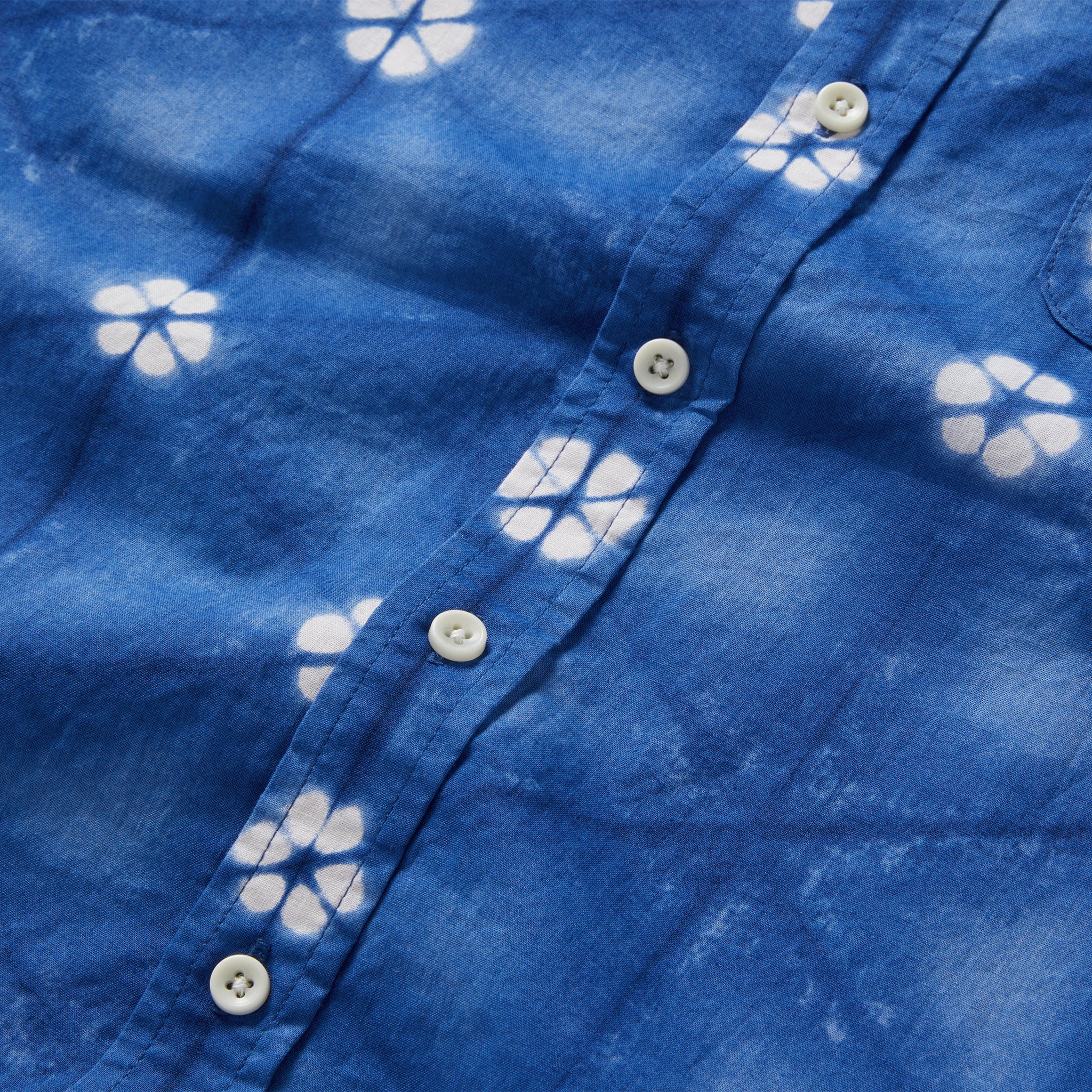material shot of the buttons on The Short Sleeve Jack in Deep Navy Floral, Wovens by Taylor Stitch