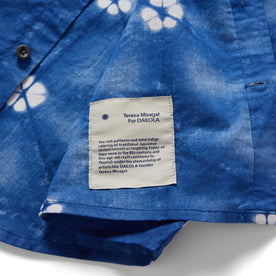 material shot of the Teresa Misagal for Dailola label on The Short Sleeve Jack in Deep Navy Floral