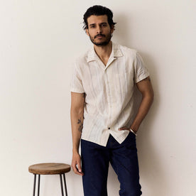fit model standing in The Short Sleeve Hawthorne in Fog Stripe, Wovens by Taylor Stitch