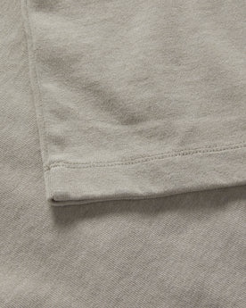 material shot of the sleeve on The Short Sleeve Heavy Bag Henley in Fog, Knits by Taylor Stitch