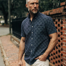 fit model standing in The Short Sleeve Jack in Navy Diamond