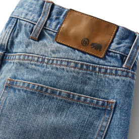 material shot of the logo patch on The Slim Jean in Fletcher Wash Organic Selvage